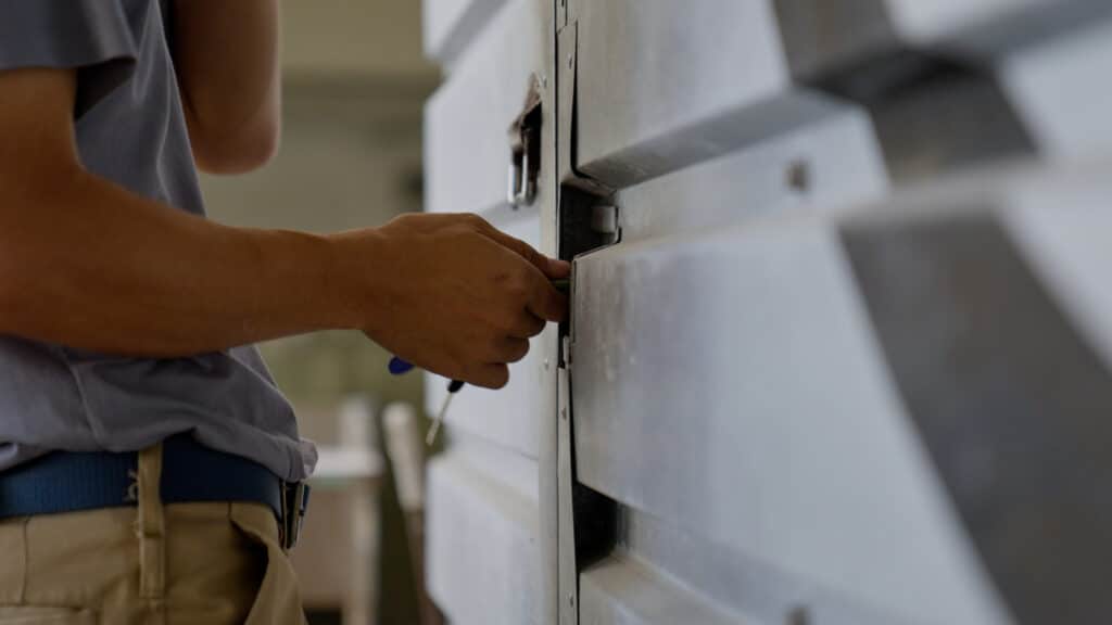 Garage door fitting